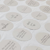 Round milestone cards with motivational phrases on a white background