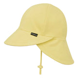 A pale yellow sun hat with a curved brim, a chin strap with a knot, and a small black brand tag on the side, shown against a light gray background.