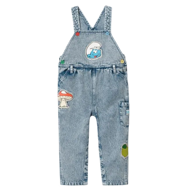 Denim overalls with colorful smurf themed patches on a white background