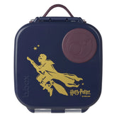 Navy blue lunch box with gold silhouette of a character and 'Harry Potter' branding on a light gray background