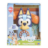 Bluey Bluey Telephone toy in its original retail packaging, featuring a light blue dog-shaped telephone with a yellow snout, blue ears, and an orange telephone receiver in the background.