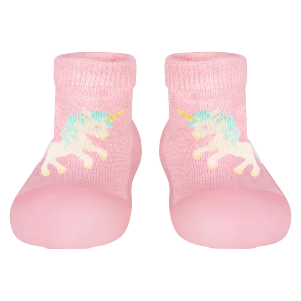 A pair of pink organic hybrid walking socks with a unicorn design and skid resistant rubber soles for babies.