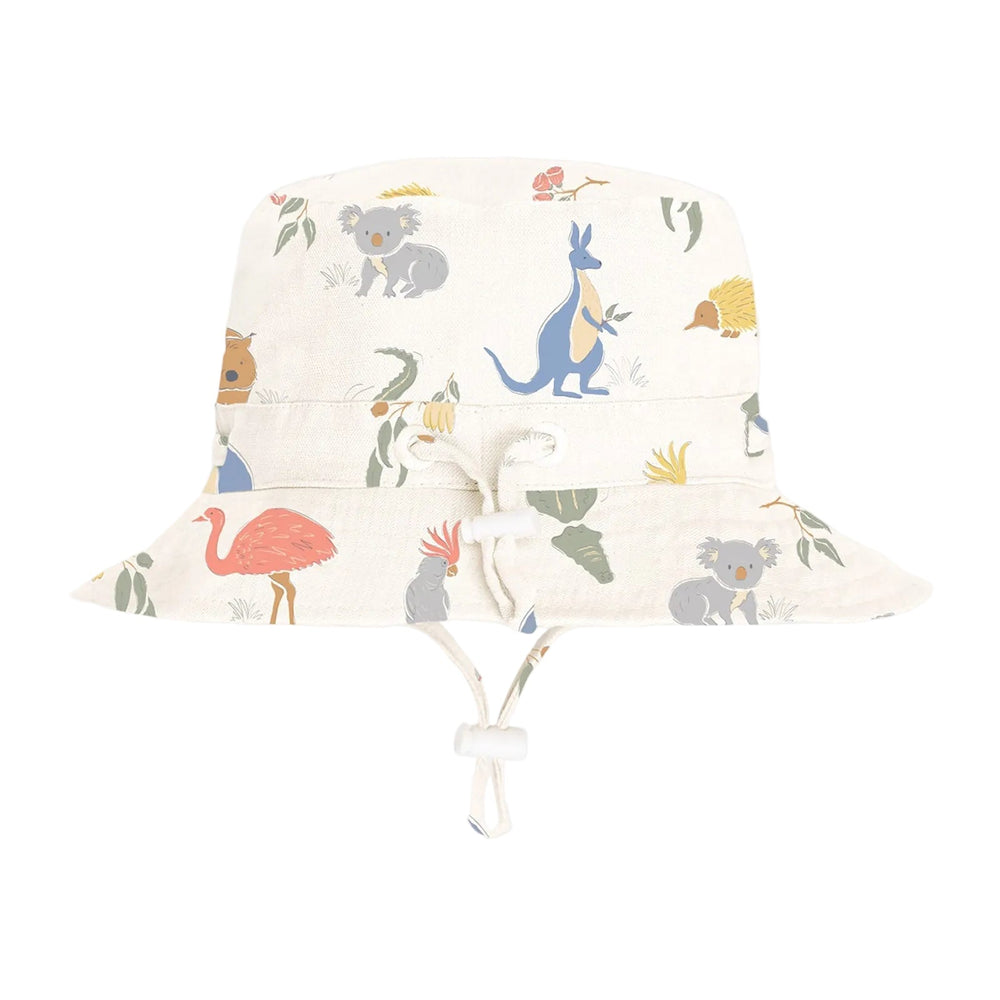 A white sun hat with a broad brim featuring a colorful Aussie animal print, including a giraffe, an elephant, a flamingo, and a crocodile.