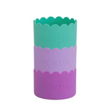 Three colours: green , light purple and purple bumper cups with 'MONTII' branding on a white background