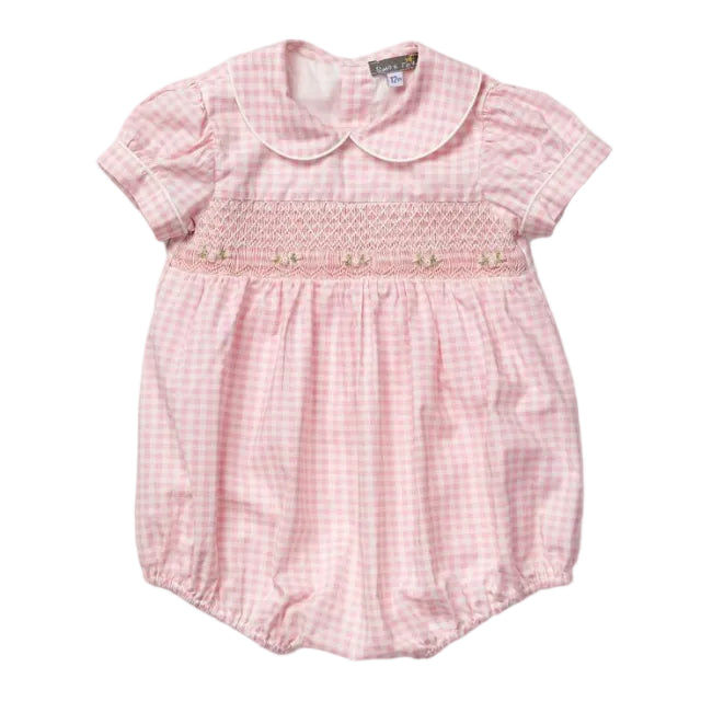 A pink and white gingham baby romper with a smocked chest panel and embroidered bow details, featuring a Peter Pan collar and short puff sleeves.
