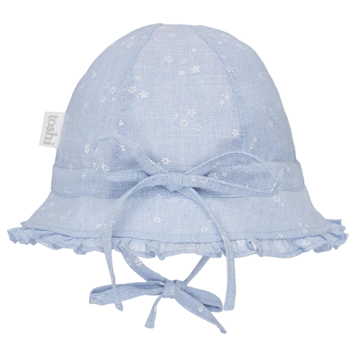 A light blue fabric baby sun hat with a white floral pattern, featuring a wide brim with ruffled trim, a matching bow on the front, and chin ties. A small fabric tag on the side reads 'loohi'.