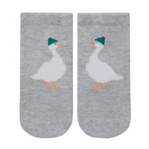 Pair of gray socks with duck design on a light gray background