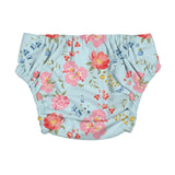 The back of a baby swim nappy with pink flowers on a blue background