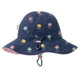 A navy blue quilted bucket hat with a colorful floral print, featuring a pink chin strap and a small fabric brand tag on the side.