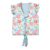 A light blue children's zip-front vest with a floral print, ruffled cap sleeves, and a tie detail at the bottom, shown on a plain light gray background.