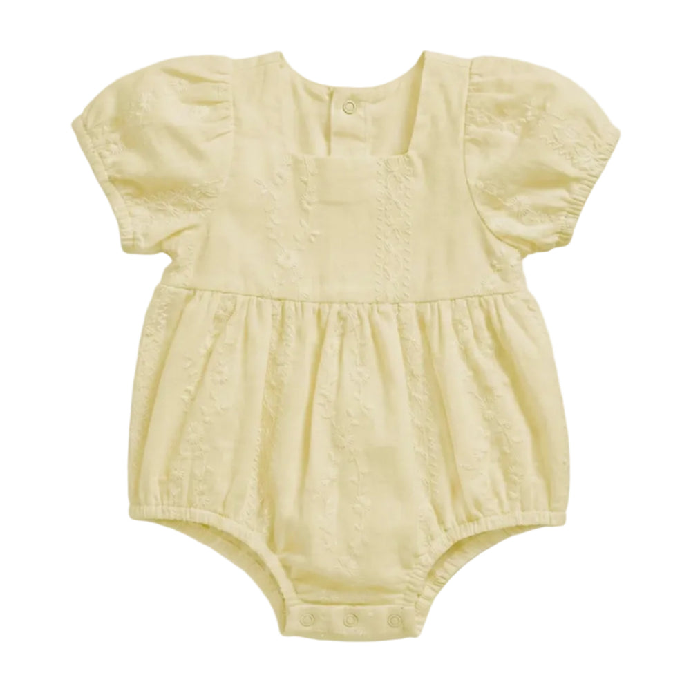 A pale yellow baby romper with short puff sleeves, a square neckline, and a gathered waist, shown flat against a light gray background.