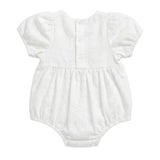 A white short-sleeve baby romper with puff sleeves, a buttoned back, and a gathered waist, shown flat on a light gray background.