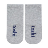 Two gray socks with 'toshi' branding on a white background