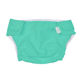 Green swim diaper with UPF 50+ sun safety label on a white background