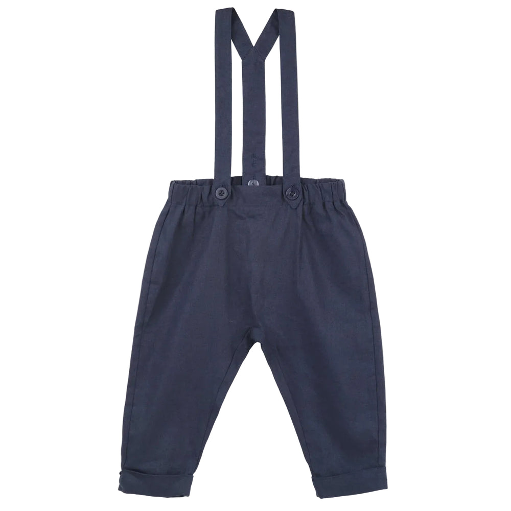 Navy linen suspender pants with adjustable straps and matching suspenders, featuring front buttons.