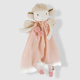 Stuffed toy fairy with a pink dress on a light gray background