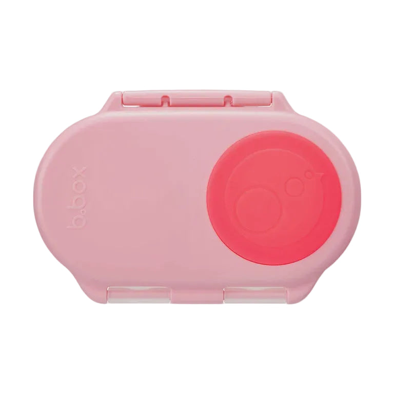 Pink b.box lunch box with a flamingo pink circle on the lid on a light gray background