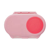 Pink b.box lunch box with a flamingo pink circle on the lid on a light gray background