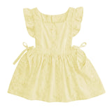 A pale yellow baby girl's dress with ruffled cap sleeves, a square neckline, and side ties, shown against a light gray background.