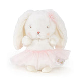 White plush bunny with a pink skirt on a white background