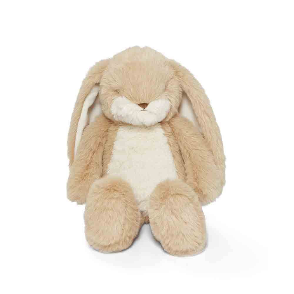 Plush bunny toy with beige fur and white interior on a white background