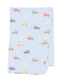 A knitted baby wrap with a pattern of various vehicles printed in multiple colors on a light blue background.