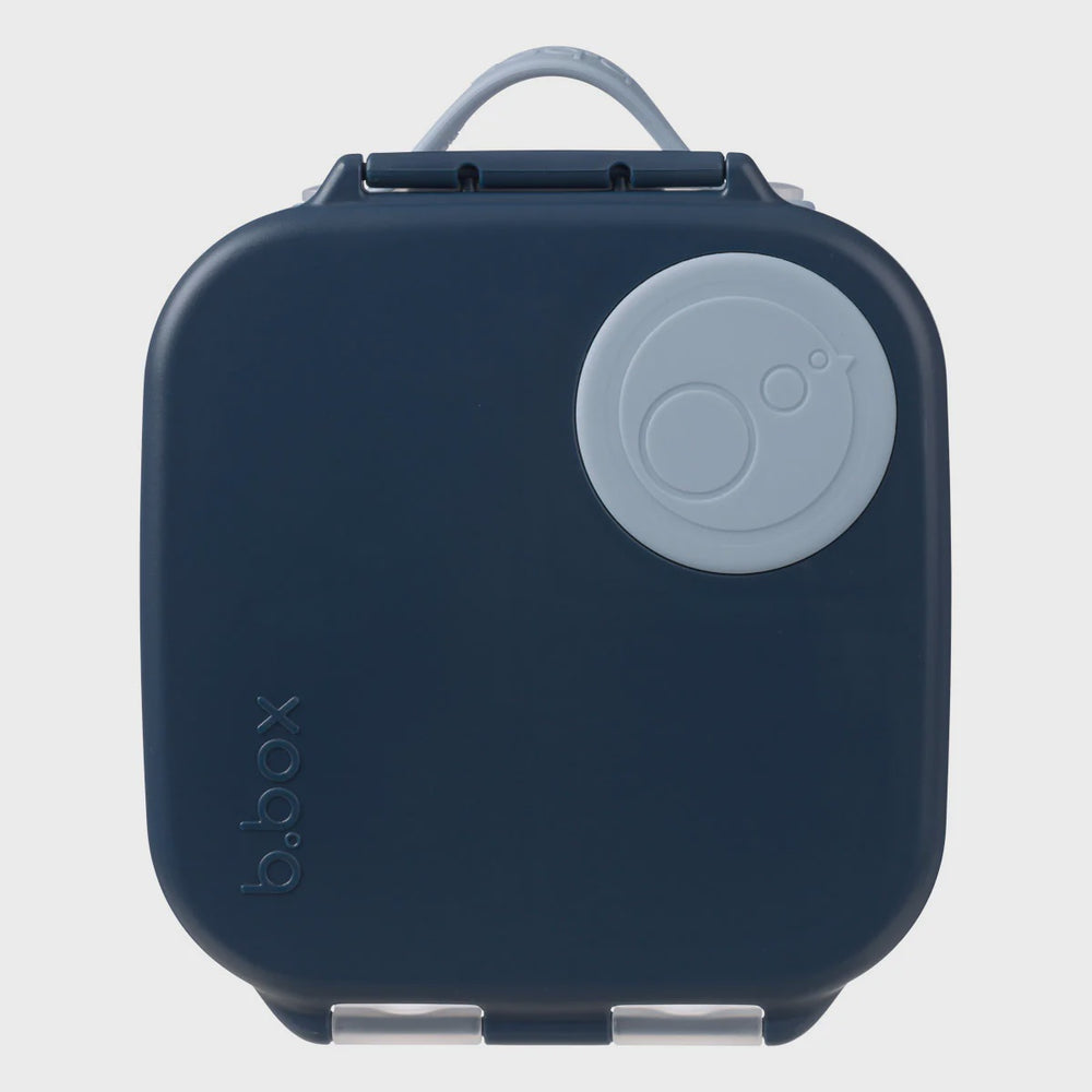 Navy blue b.box lunch box with a gray handle on a light gray background
