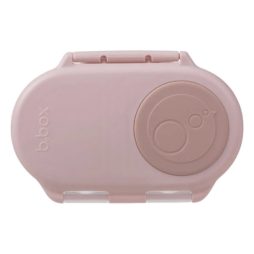 Pink b.box snack container on a light gray background