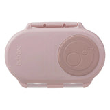 Pink b.box snack container on a light gray background