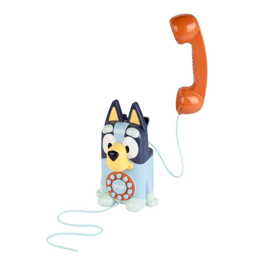 Bluey-themed toy rotary phone with a light blue dog body, dark blue ears and face, yellow snout, and an orange handset on a white background.