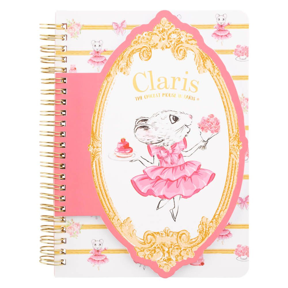 A5 layered notebook with a die cut on the front featuring an illustration of a Claris  from Paris character in a pink dress holding a blue flower, with gold foil detail on the cover and a gold wire spiral.