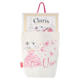Claris tote bag with a claris book peeking out of it