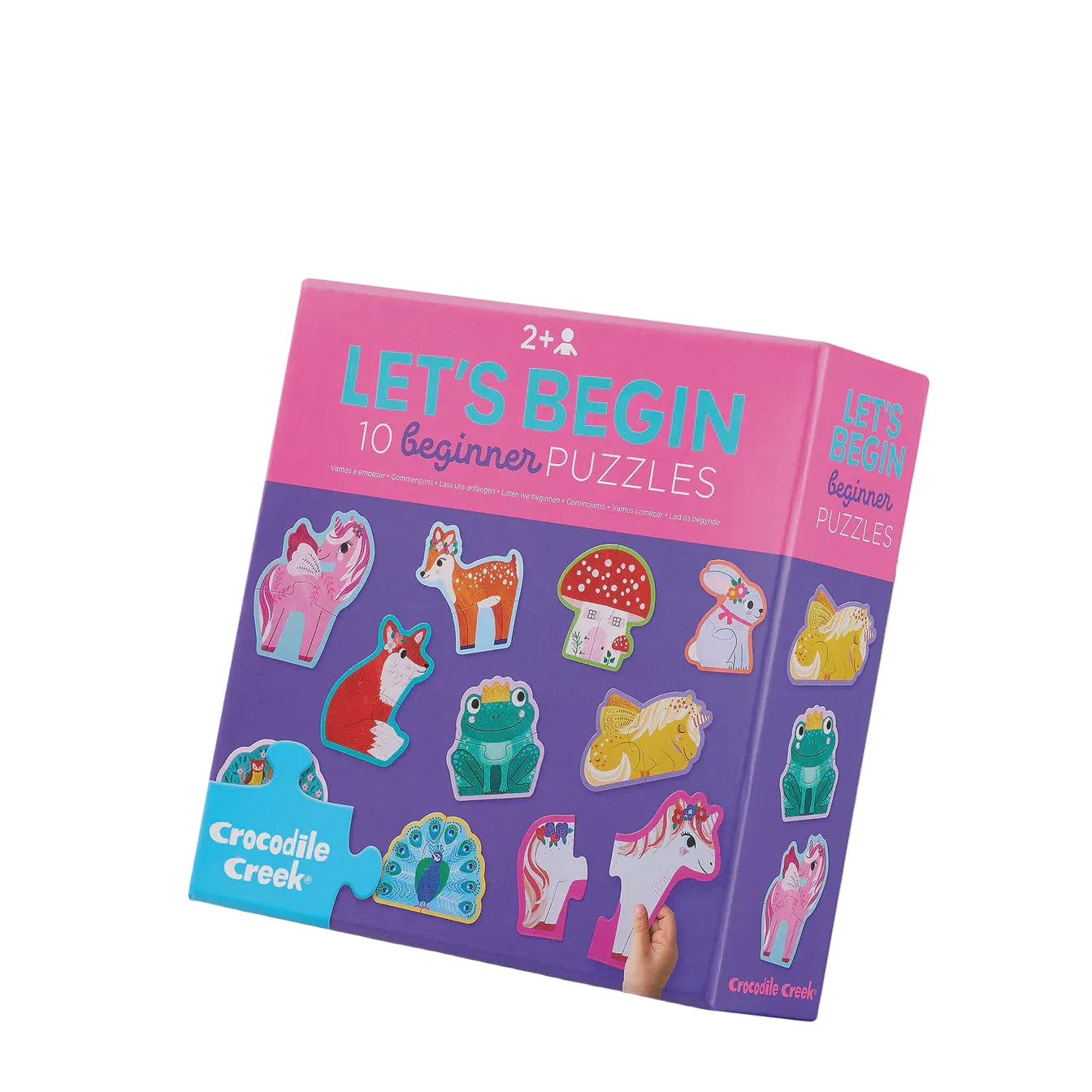 Crocodile Creek 'Let's Begin' 10 Beginner Puzzles box, featuring a pink and purple design with colorful animal puzzle illustrations, shown on a light gray background.