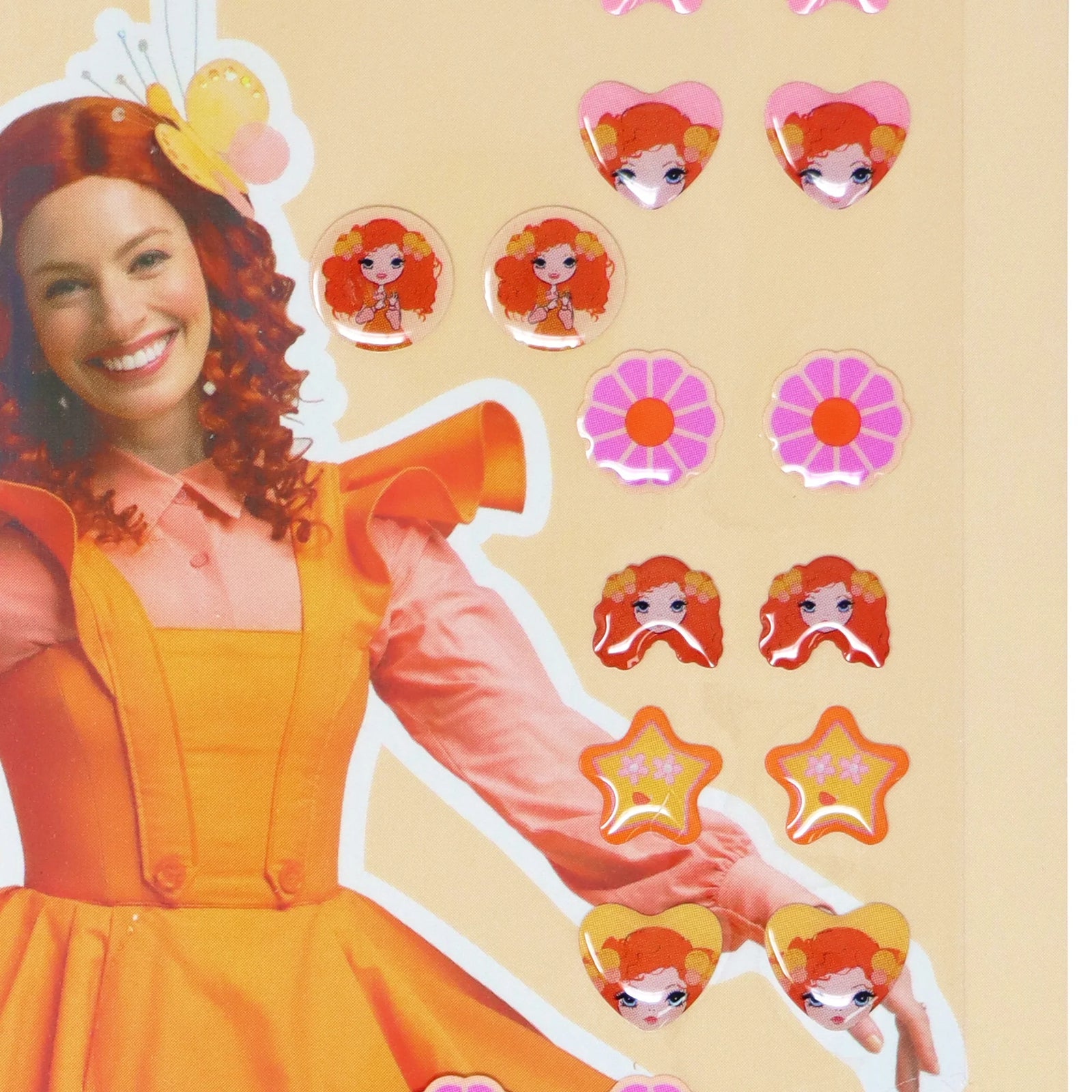 Packaging for Emma Memma Stick on Earrings featuring the product name, an image of a character resembling Emma, and various earring designs to be applied to the ears.