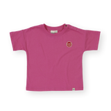 Pink t-shirt with a logo on a white background