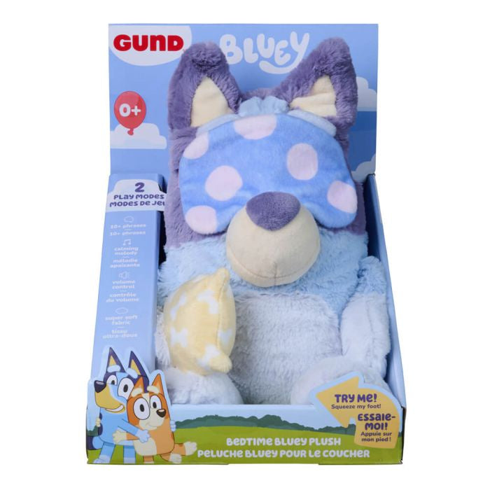 Gund Bluey bedtime plush toy in its original retail packaging, featuring a blue and purple spotted plush dog with a small yellow star pillow.