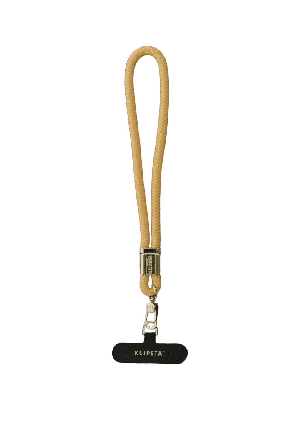 A beige leather wrist strap with a silver metal clasp and a black KLIPSTA tag hanging below, displayed on a dark background.