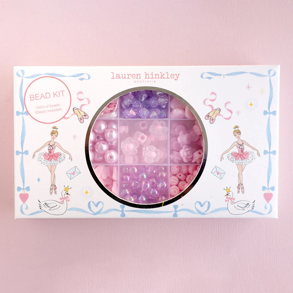 Bead kit packaging with pink and purple beads on a pink background, featuring the brand 'lauren hinkley'.