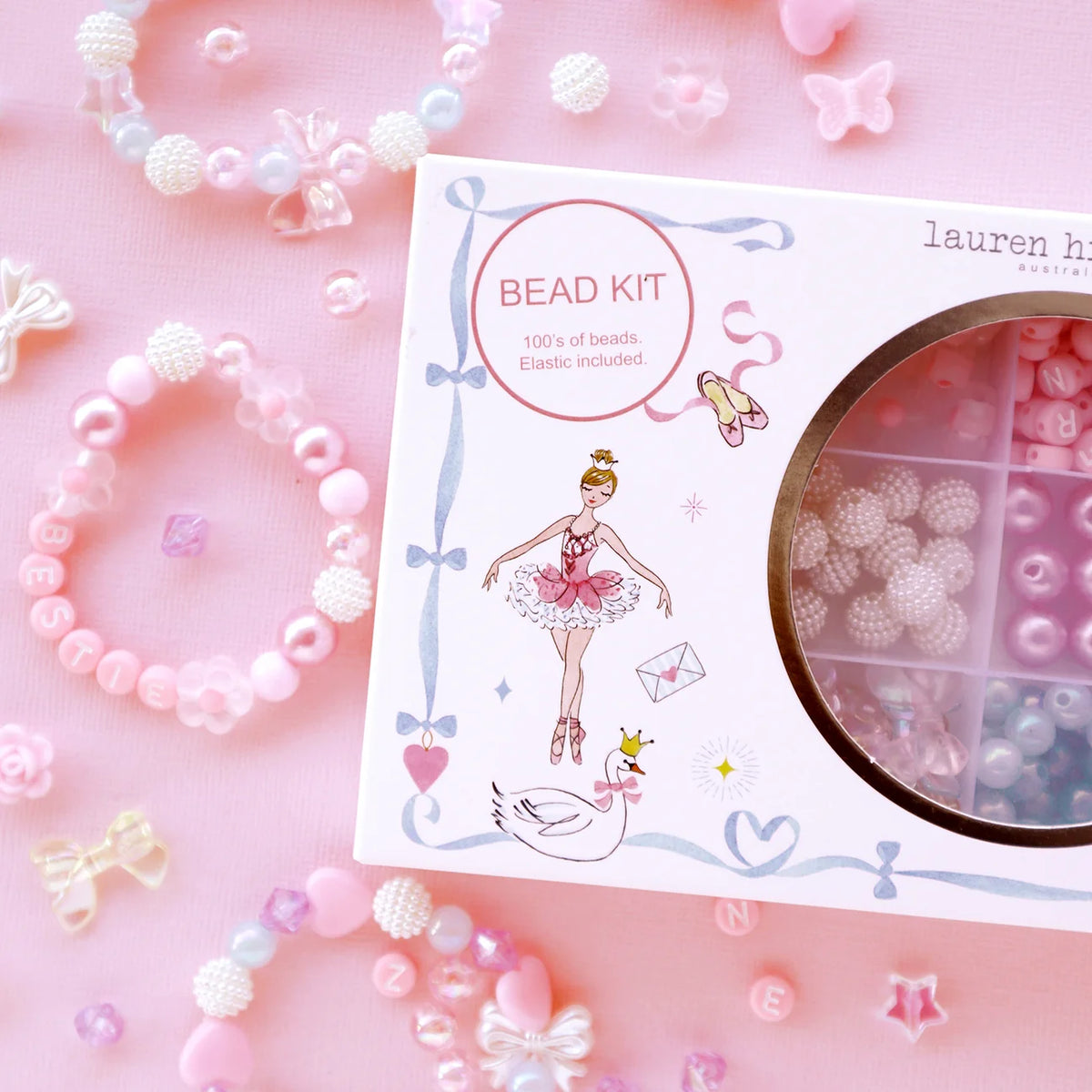 Bead kit with packaging featuring a ballerina design on a pink background with beads and decorative elements.