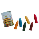 Set of colorful beeswax crayons with a box on a light gray background