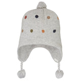 Gray knit baby hat with colorful polka dots and tassels on a white background