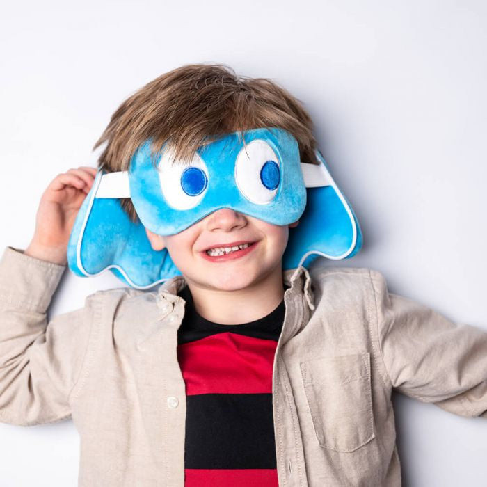 A child wearing a blue Pac-Man themed eye mask with character patterns