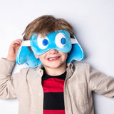 A child wearing a blue Pac-Man themed eye mask with character patterns