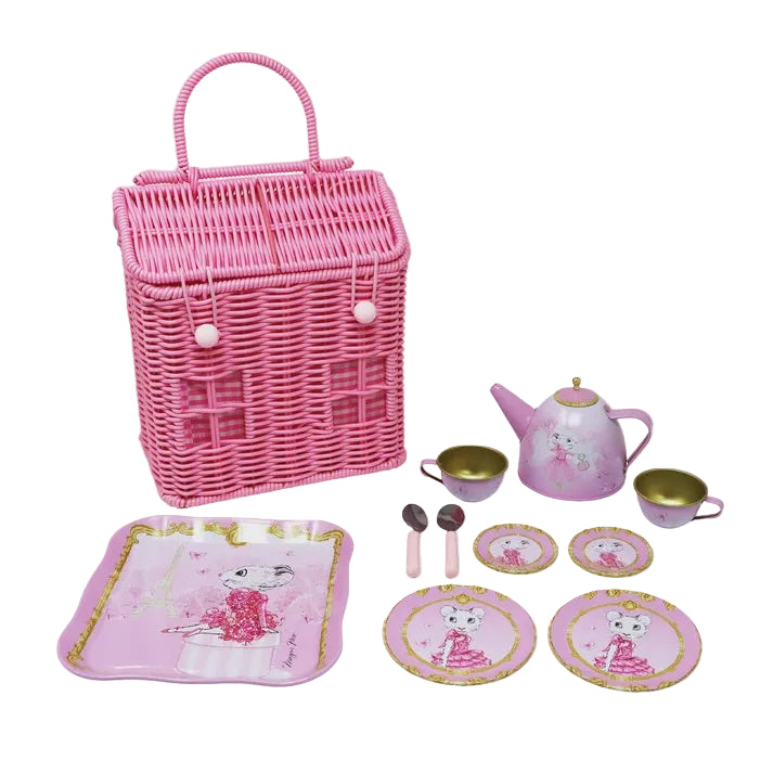 A children's pink wicker picnic set  of Claris from Paris Set with a large wicker basket, a pink teapot, cups, plates, spoons, and a serving tray, all decorated with a cartoon cat illustration and gold trim, on a white background.