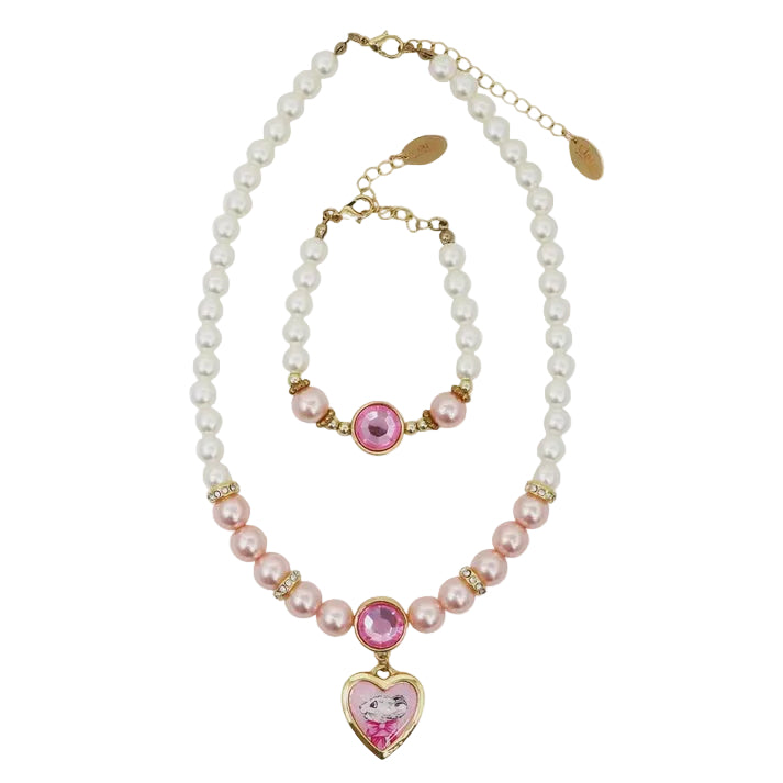 A matching pearl jewelry set featuring a necklace and bracelet with gold-tone hardware, pink faux pearls, a central pink gem, and a heart-shaped pendant with a cartoon character on a light gray background.