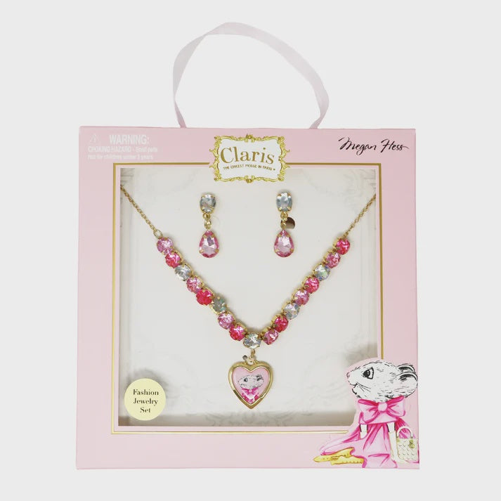 A children's jewelry set featuring a gold-tone necklace and matching clip-on earrings. The necklace has a heart-shaped pendant with a cartoon girl illustration, and the chain is decorated with pink, clear, and iridescent rhinestones.