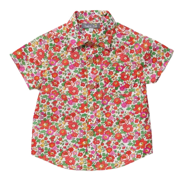 Floral boys shirt with red, pink and orange flowers on it with green leaves on a white background
