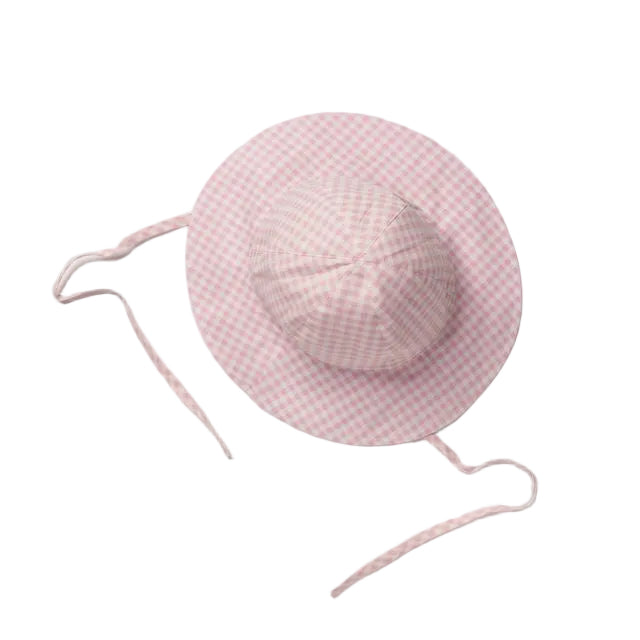 A pink and white gingham sun hat with adjustable tie straps, laid flat on a light gray background.