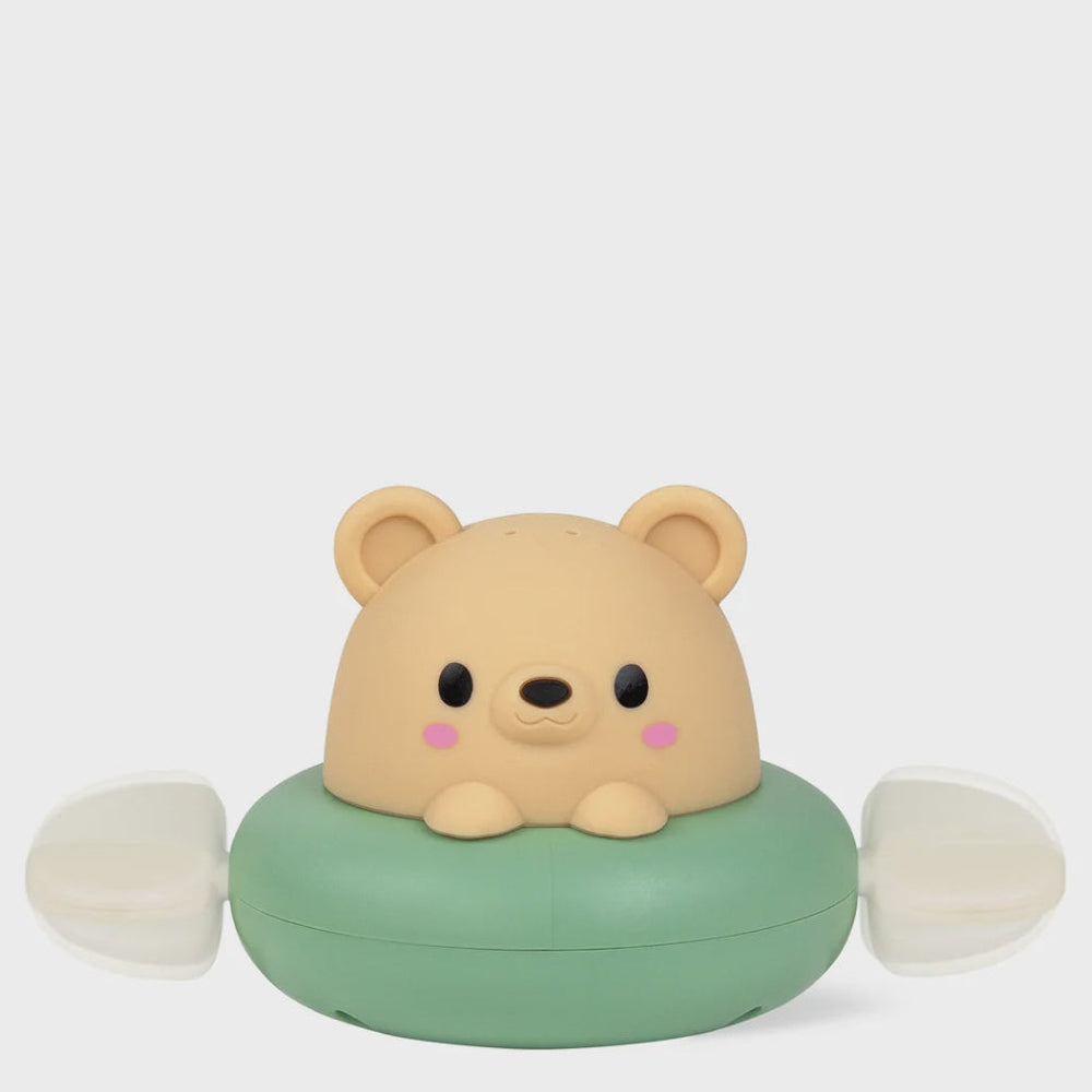 A cute bear-shaped portable fan with a beige teddy bear head and a mint green circular base, featuring white wind blades on both sides, set against a plain light gray background.