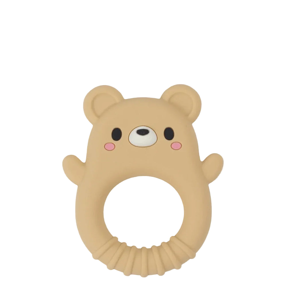 A beige silicone baby teether shaped like a bear face with a circular ring handle, featuring black eyes, a white snout, and pink cheeks, shown on a light gray background.